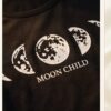527787b6-09de-47dc-ae33-ba87c8e1bec6 “Moon Child” Pyjama Set — Black Moon Phase Print Tee & Shorts