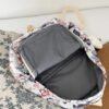 BS-ACC-023_4 White Butterfly Print Backpack with Plush Charm