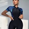 Black Zip-Front Romper with Blue Floral Panels