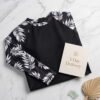 BS-SWM-131_4 Black Long-Sleeve Boyleg Swim Romper with Tropical Print Sleeves