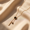 img_0221-2 Gold-Tone Stainless Steel Lariat Necklace – Black Onyx Drop Pendants