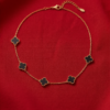Gold-Tone Stainless Steel Clover Charm Necklace – Black, Grey & White Enamel