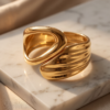 Sculptural Wrap Cuff Bracelet — Gold-Tone Stainless Steel, Hinged Opening