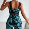Teal Tropical Print Swim Romper – Asymmetric Crisscross Strap Detail