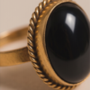 img_9622-2 Vintage Gold-Tone Oval Black Onyx Statement Ring – Braided Edge Detail