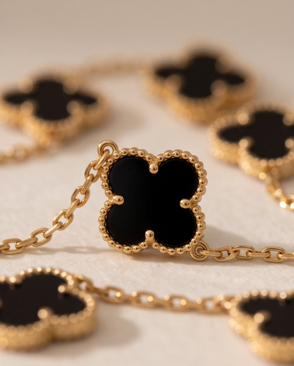 Stainless Steel Chain Bracelet with Black Clover Charms – Gold-Tone