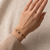 Stainless Steel Chain Bracelet with Black Clover Charms – Gold-Tone