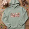 Gingerbread Hot Cocoa Print Hoodie — Sage Green Kids’ Pullover (Age 12)